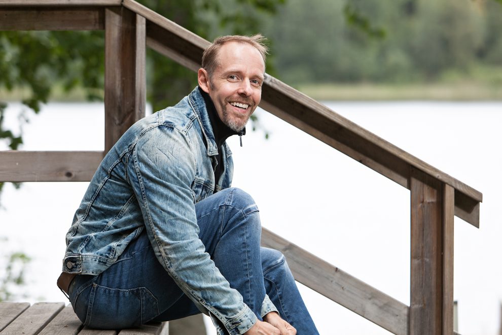 Guy sitting by the lake
